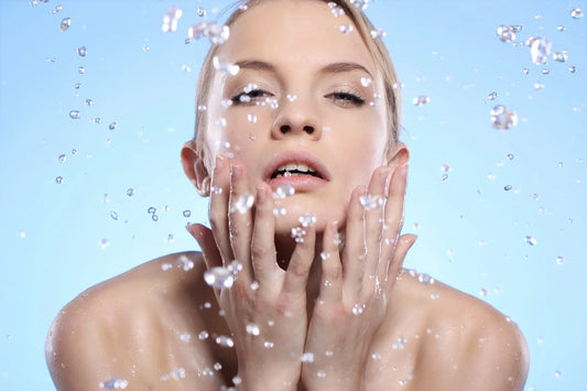 woman washing her face
