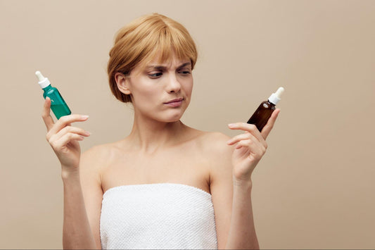 A woman holding two bottles of skin care products, showcasing her interest in beauty and personal care